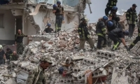 قصف روسي يستهدف مبنى سكنياً بخاركيف