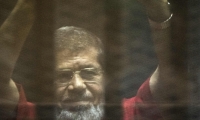 الحكم على مرسي في قضية التخابر مع قطر