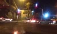 مواجهات بين الشرطة وشبان ملثمين في مدينة الطيبة وإغلاق شارع 444